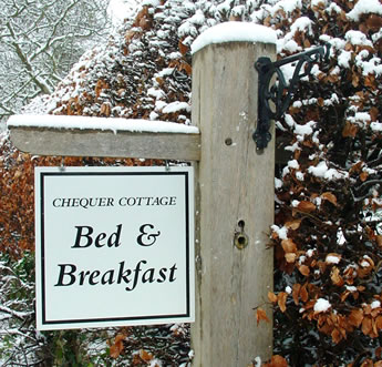B and B sign in snow