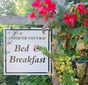 B and B sign with hanging basket